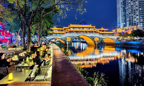 Anshun Bridge illuminated at night over the Jinjiang River in Chengdu