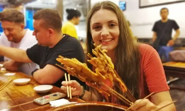 Trying local street food at a Chengdu night market