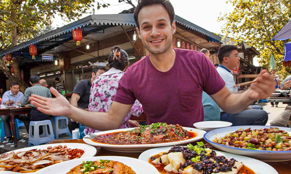 Traveler enjoying authentic Sichuan cuisine at a local restaurant in Chengdu