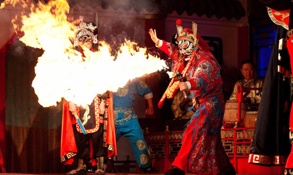 Sichuan Opera performer showing a dramatic face-changing performance in Chengdu