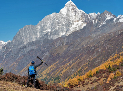 Hiking trail through alpine grasslands in Haizi Valley