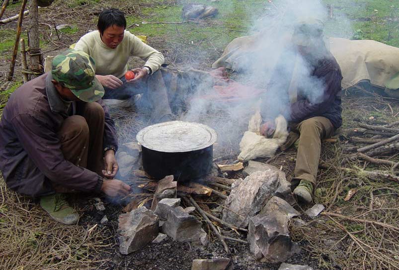 The local cook are preparing our clients' dinner.