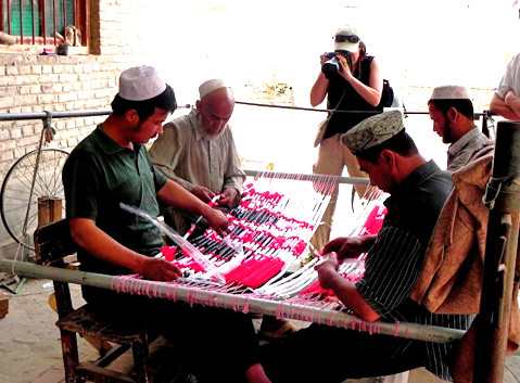 Hotan Men are making silk.