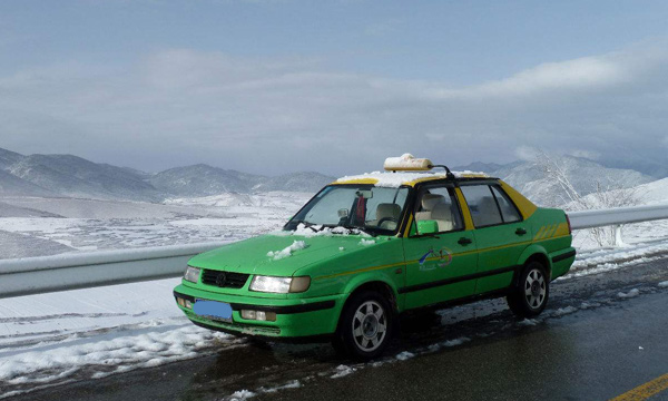 A 4-seat car from Jiuhuang Airport to Huanglong National Park