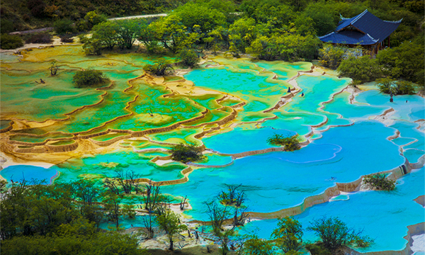 Huanglong Five-Color Pond with colorful travertine pools and turquoise water
