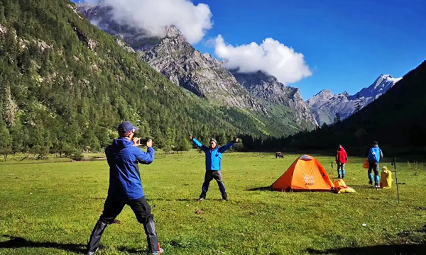 Trekkers camping in the mountains during a Mount Siguniang trek