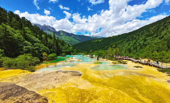 Colorful travertine pools in Huanglong National Park near Songpan