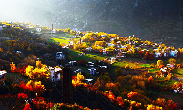 The leaves turn red in the slopes of the village during autumn.