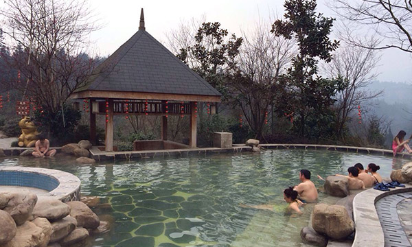 Enjoying the marvelous hot springs at the foot of the mountain after a day hiking in the mountain.
