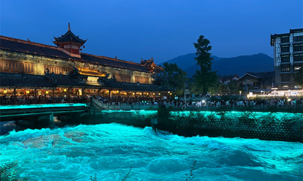 Dujiangyan night view with blue glowing water in Sichuan, China