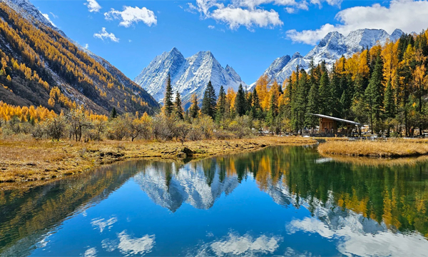 Shuangqiao Valley autumn scenery with snow mountains and lake