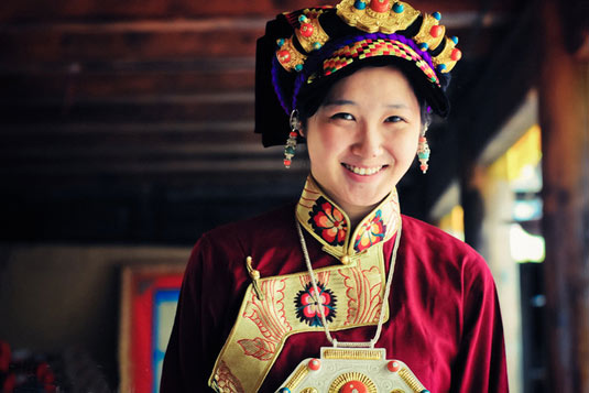 Woman of Jiarong Tibetan wears traditional clothes.